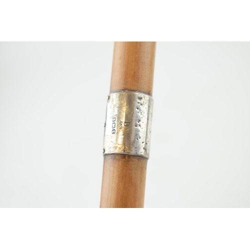 561 - An early 20th century walking cane with silver collar, Birmingham 1918, J Howell & Co, inscription t... 