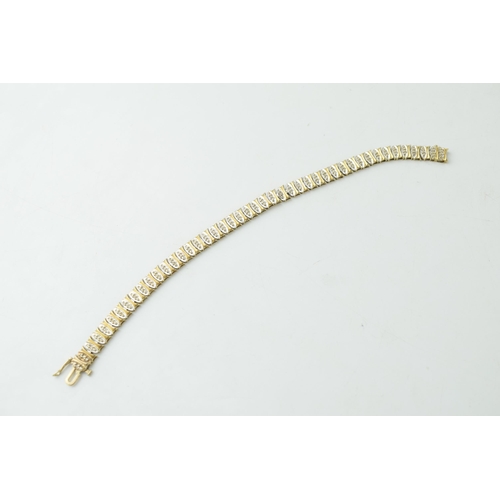 339 - 9ct hallmarked gold bracelet set with white stones, 18cm, 10.2g.