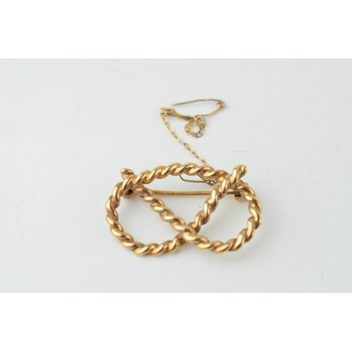 340 - 9ct hallmarked gold Stafford knot brooch, slightly distorted, 5g.