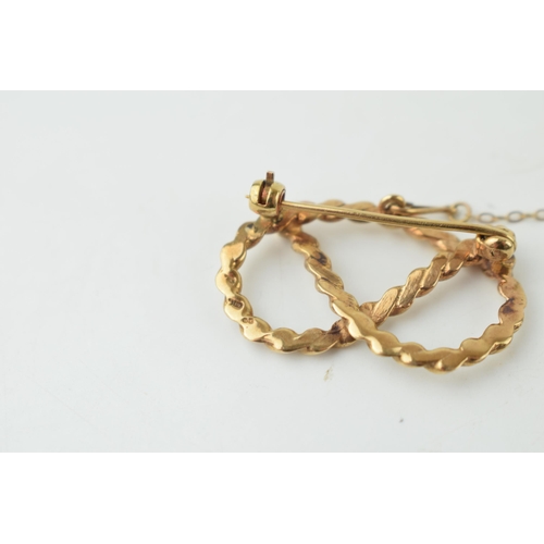 340 - 9ct hallmarked gold Stafford knot brooch, slightly distorted, 5g.