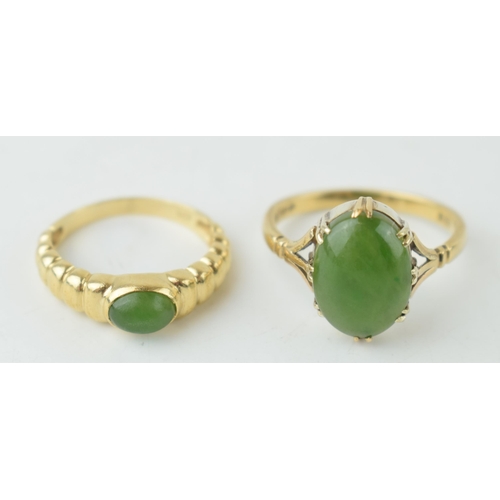 354 - Two 9ct gold rings set with jade or a similar type of stone, sizes S & N (larger stone ring),  6.3g.