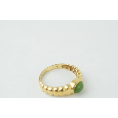 354 - Two 9ct gold rings set with jade or a similar type of stone, sizes S & N (larger stone ring),  6.3g.