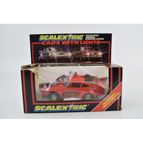 642 - A boxed vintage Scalextric C.427 Red Porsche Turbo with working head and brake lights.