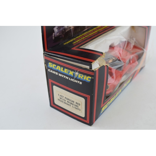 642 - A boxed vintage Scalextric C.427 Red Porsche Turbo with working head and brake lights.