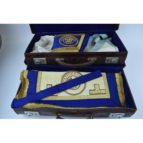 434 - Of masonic interest, two leather masonic cases with Staffordshire embroidererd regalia and gloves. (... 