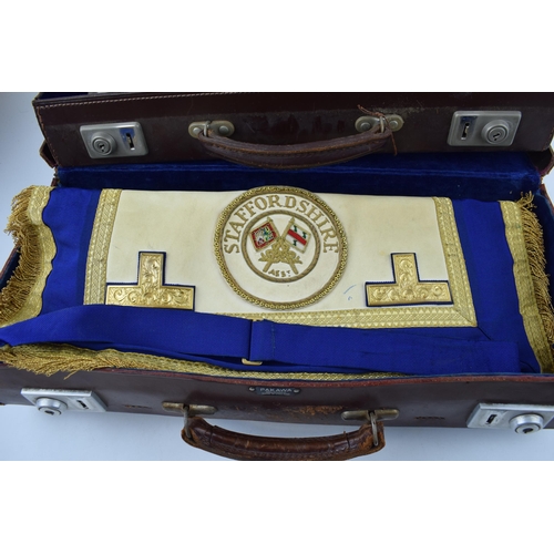 434 - Of masonic interest, two leather masonic cases with Staffordshire embroidererd regalia and gloves. (... 