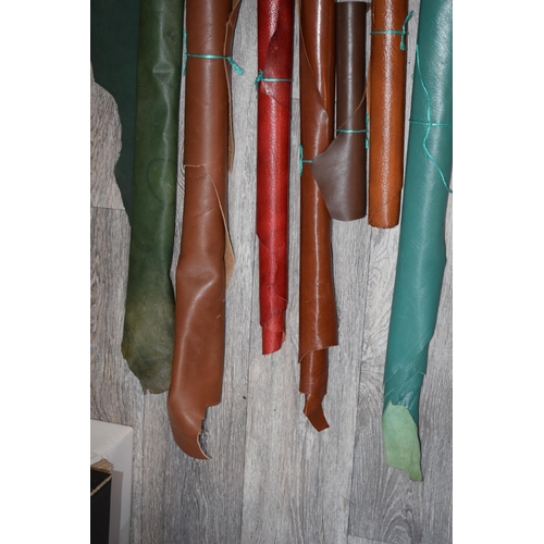 448 - A quantity of vintage and antique leather calf skins. To include calf skins, brown / tan approx 79cm... 