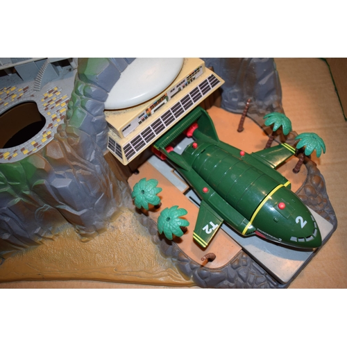 698 - Vintage Thunderbirds Tracy Island with Thunderbirds 2 original die-cast figure.