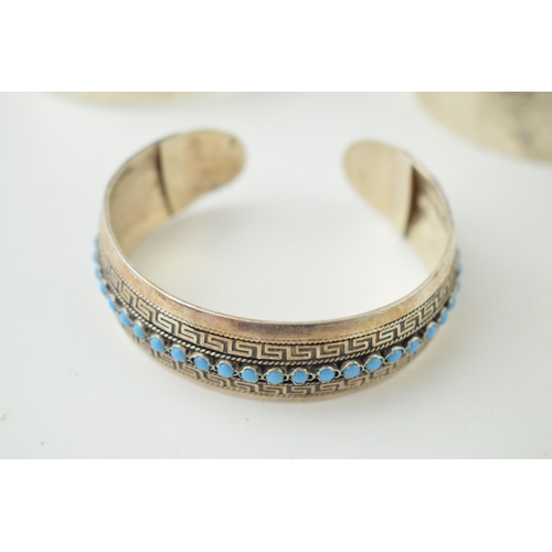 366B - Three silver bangles, 2 are UK hallmarked, the other overseas example set with turquoise and stamped... 