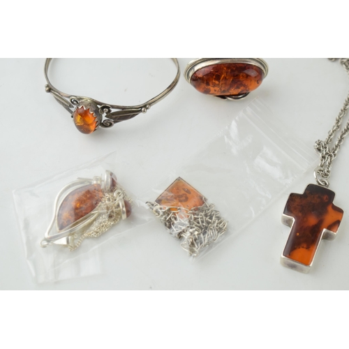 366C - 8 pieces of silver & faux amber, to include 3 pendants & chains, 2 pairs of earrings, large cross & ... 