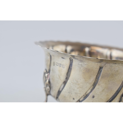 369 - Silver three-footed bowl, Chester 1900, swirling decoration, 136.0 grams.