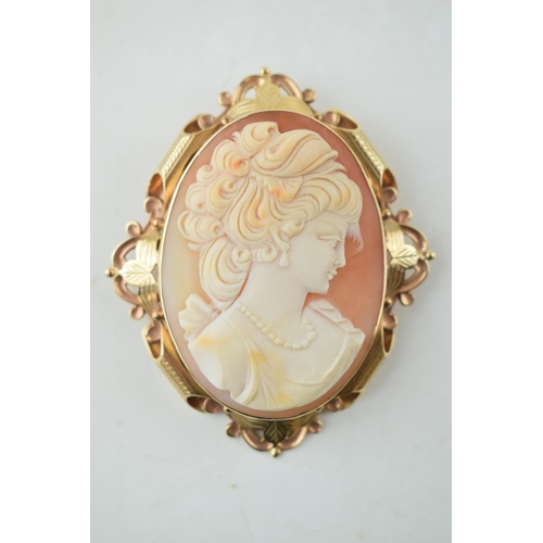 383 - 9ct gold cased large cameo brooch, with a lady's profile, 31.4 grams, 8cm long.