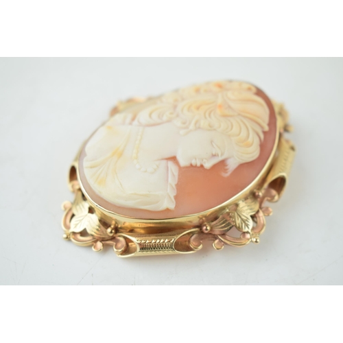 383 - 9ct gold cased large cameo brooch, with a lady's profile, 31.4 grams, 8cm long.