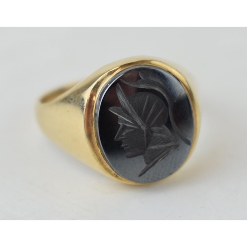 384 - 9ct gold gent's ring with a centurion profile, 4.8 grams, size R.