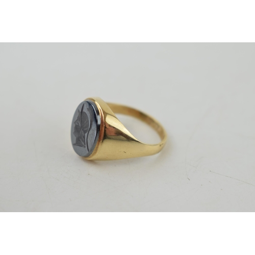 384 - 9ct gold gent's ring with a centurion profile, 4.8 grams, size R.