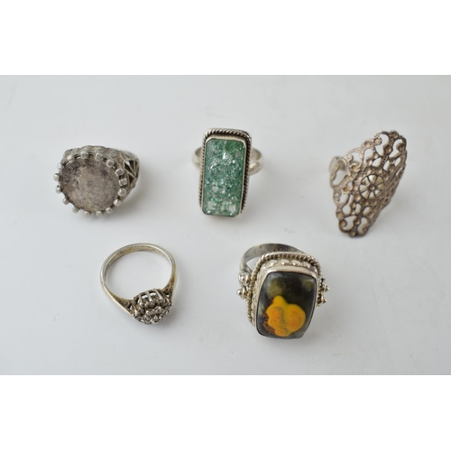 386 - A collection of assorted silver dress rings, some chunky examples (5), 32.5 grams.