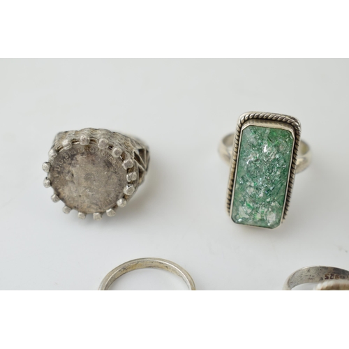 386 - A collection of assorted silver dress rings, some chunky examples (5), 32.5 grams.