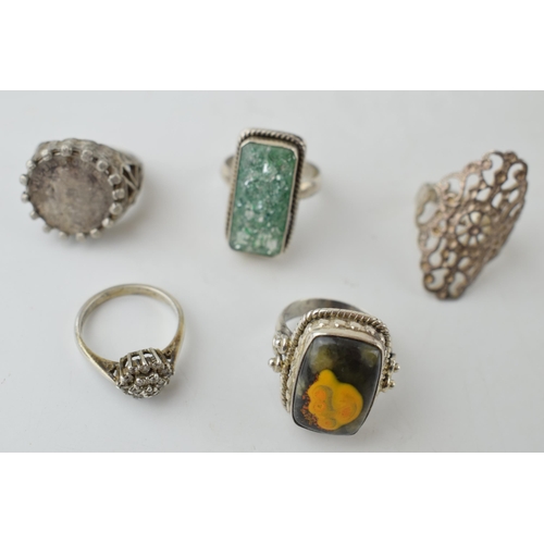 386 - A collection of assorted silver dress rings, some chunky examples (5), 32.5 grams.