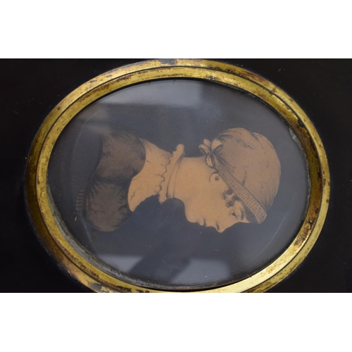 395 - A pair of framed miniature portraits, to include a man and a woman, in black mounts (2), circa 8cm l... 