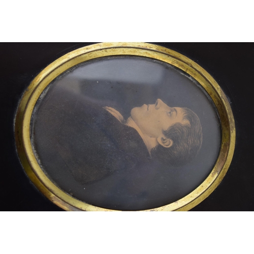 395 - A pair of framed miniature portraits, to include a man and a woman, in black mounts (2), circa 8cm l... 