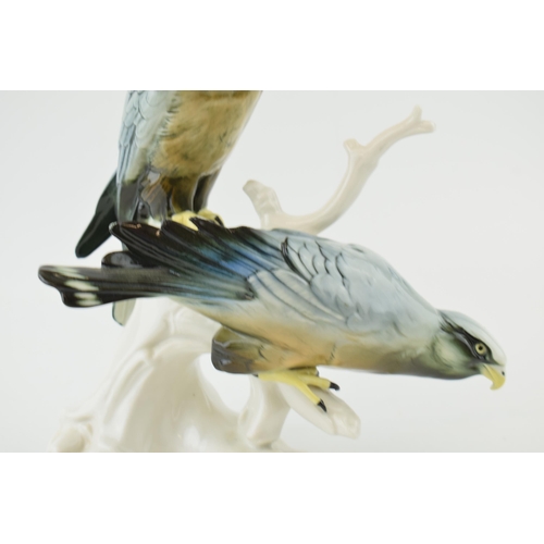 101 - Karl Ens figure of two eagles perched on a stump, in gloss, 27cm tall.