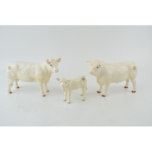 126 - Boxed Border Fine Art Pottery Company Bull, Cow and Calf. (3)