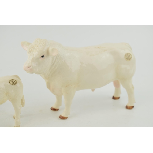 126 - Boxed Border Fine Art Pottery Company Bull, Cow and Calf. (3)