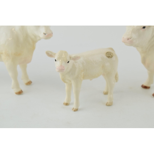 126 - Boxed Border Fine Art Pottery Company Bull, Cow and Calf. (3)