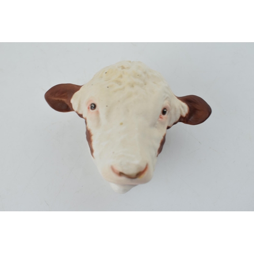 176 - Unusual Beswick wall hanging in the form of a Hereford bull's head, 8cm long.