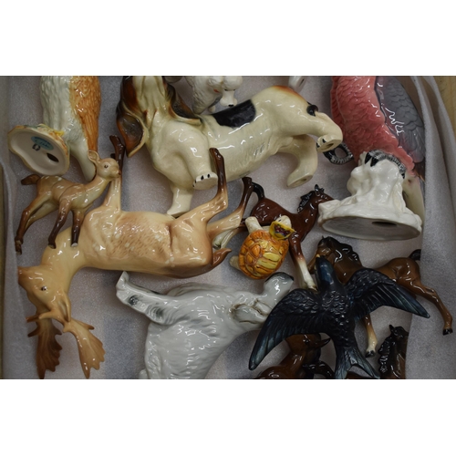 188 - A collection of pottery to include Beswick animals such as a deer, a cockatoo, a corgi and others (a... 