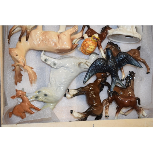 188 - A collection of pottery to include Beswick animals such as a deer, a cockatoo, a corgi and others (a... 