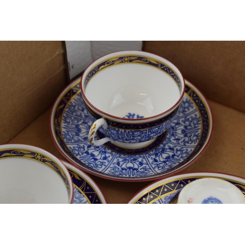 255 - An early set of Royal Worcester cups and saucers in the Royal Lilly pattern, 5 cups and 5 saucers (1... 