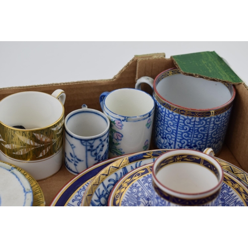 275 - A collection of 19th and 20th century coffee cans and tea cups together with a trio, predominantly o... 