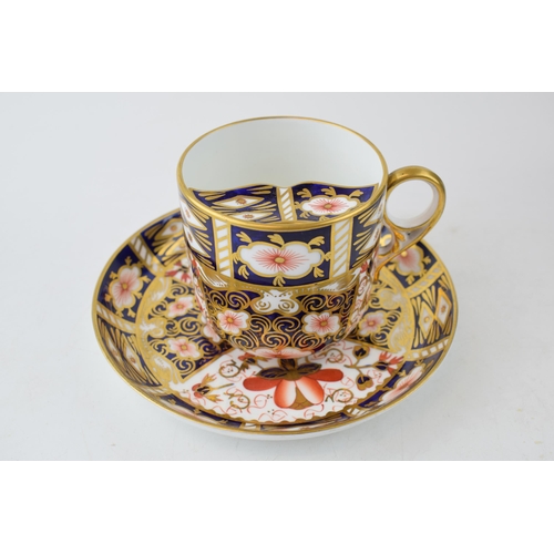 31 - An Edwardian Royal Crown Derby bone china moustache cup and saucer in Imari pattern (2).