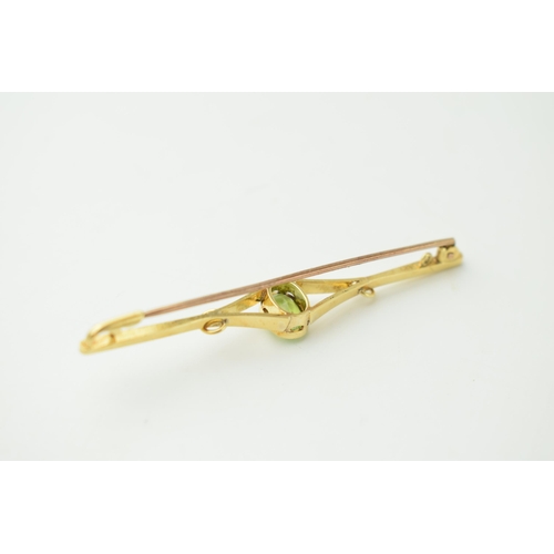 378 - 15ct gold Edwardian bar brooch set peridot, 4.9 grams, 6.5cm wide.