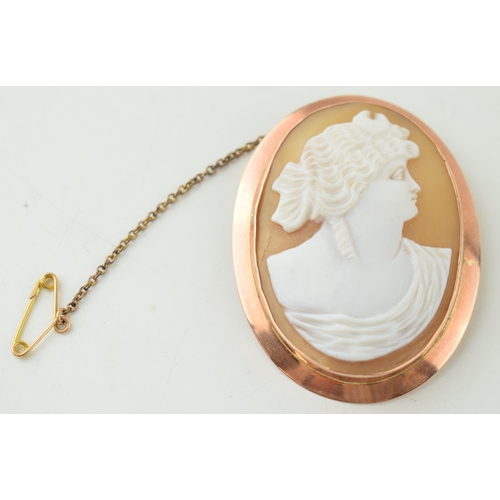 389 - 9ct rose gold cased cameo brooch with a lady's profile, 10.3 grams, 5.5cm tall.