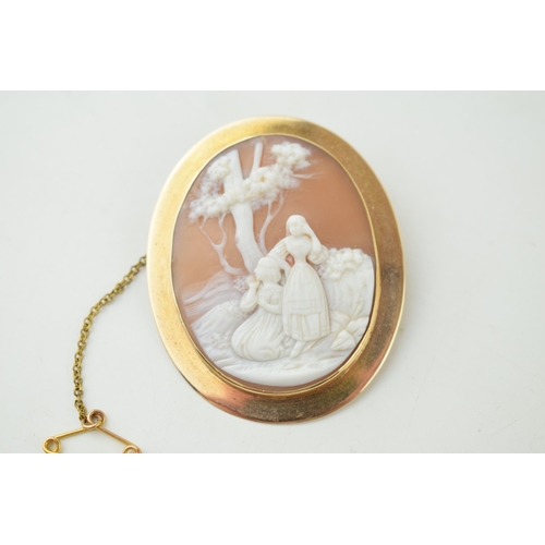 391 - Edwardian 9ct gold cased cameo brooch with a rural scene, gross weight 10.8 grams.