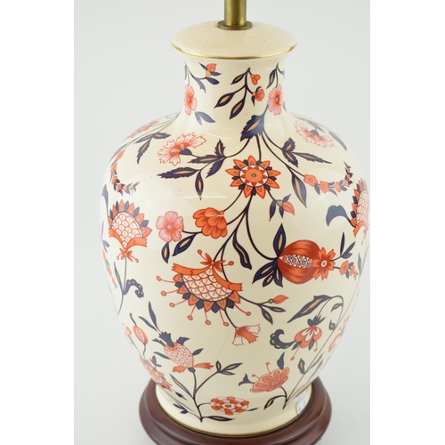 71 - A Wade lamp base in a country house style with floral decoration in red / orange and blue with gilt ... 