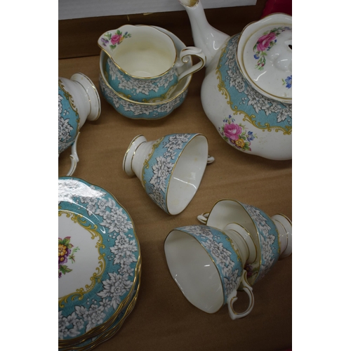 253 - Royal Albert tea ware in the Enchantment pattern to include a teapot (finial af), 6 trios, a milk ju... 