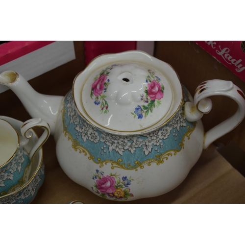 253 - Royal Albert tea ware in the Enchantment pattern to include a teapot (finial af), 6 trios, a milk ju... 