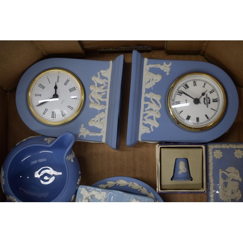 263 - A collection of Wedgwood Jasperware and Queensware items to include clocks  lidded pots, trinket tra... 