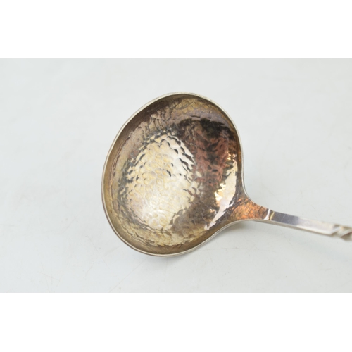 294 - Hobart sterling silver spoon with hammered bowl, twist design to handle and swirling finial, 26.3 gr... 