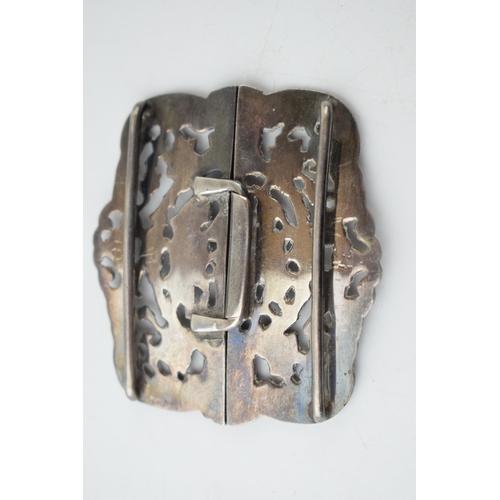 296 - Hallmarked silver ornate nurse's belt buckle with putti decoration, 33.6 grams, 6cm wide.