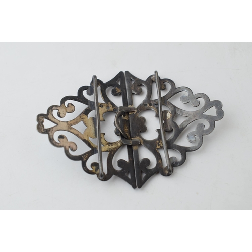 298 - Hallmarked silver ornate nurse's belt buckle, 33.2 grams, 8.5cm wide.