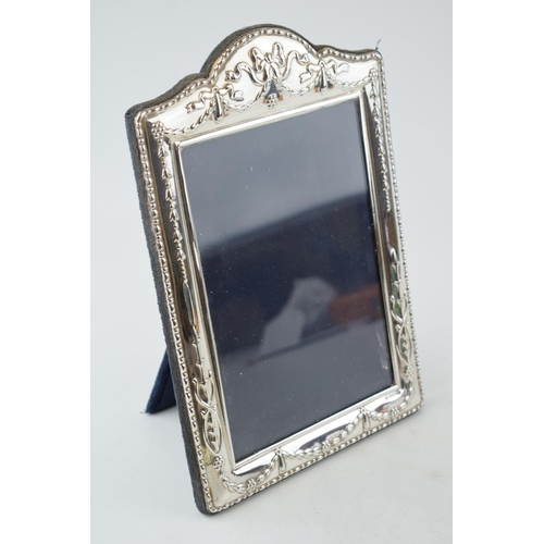 300 - Silver ornate photo frame with ribbon and bow decoration, 24.5cm tall, easel-back, Sheffield 1996.