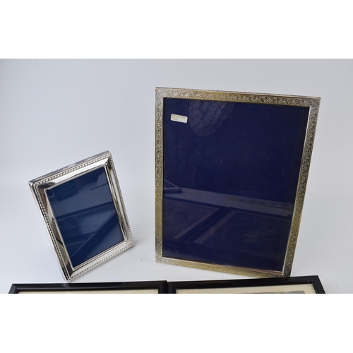 302 - A pair of silver plated photo frames, tallest 26cm tall, with a pair of French fashion prints / engr... 