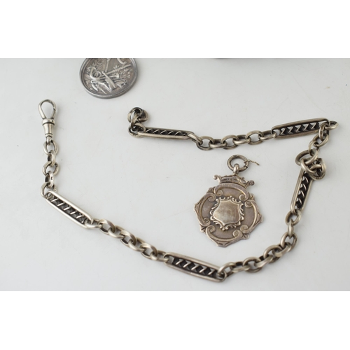 303 - An antique silver fancy link Albert chain, two silver fobs, one of musical interest, together with t... 