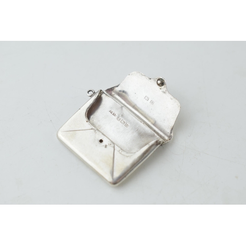 306 - Hallmarked silver stamp case in the form of a letter / purse, 4.8 grams, Birmingham 1913/1938.