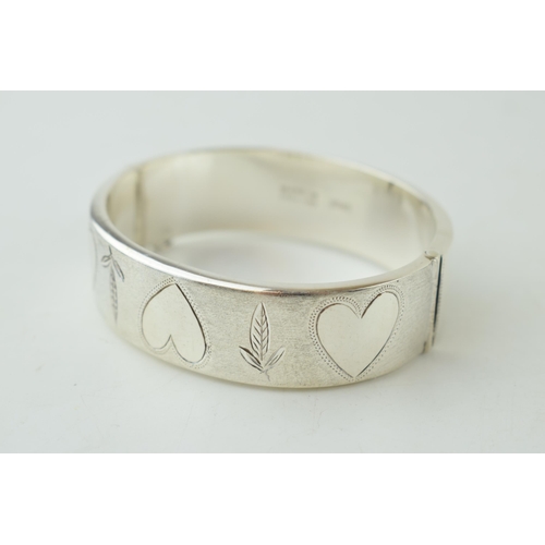 329 - Hallmarked silver wide bangle, Birmingham 1970, 30.0 grams, with hearts and floral decoration, 19mm ... 