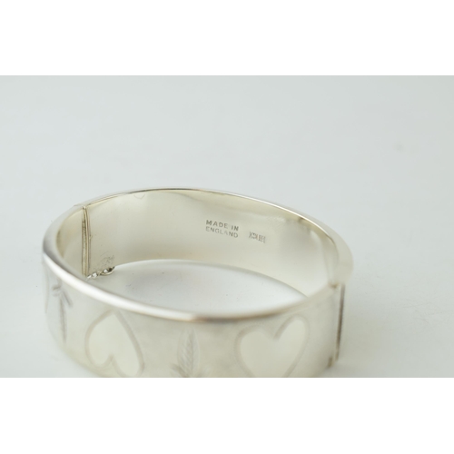 329 - Hallmarked silver wide bangle, Birmingham 1970, 30.0 grams, with hearts and floral decoration, 19mm ... 